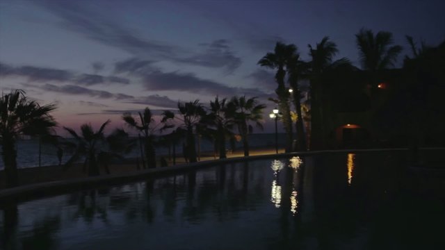 Hotel with palmtrees during sunset in Mexico