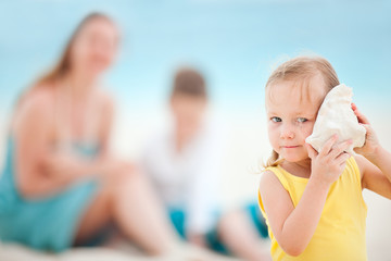 Little girl with seashell