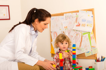 Fototapeta premium Visit at pediatrician child girl playing