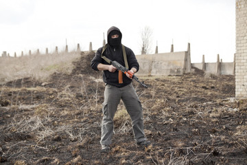 Man in mask with gun