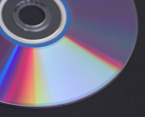 Computer optical disk isolated on black closeup