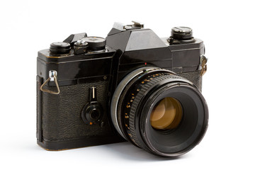 Old film camera with lens over white background