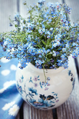 Forget-me-not flowers on a wooden table