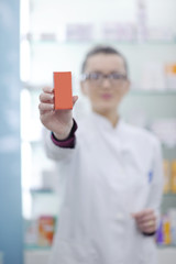 pharmacist chemist woman standing in pharmacy drugstore