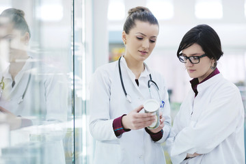 Fototapeta premium team of pharmacist chemist woman in pharmacy drugstore