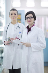 team of pharmacist chemist woman  in pharmacy drugstore