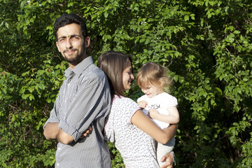 Angry family with little girl in a park