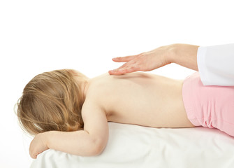Fototapeta na wymiar Nurse's hand massaging back of a little baby girl