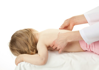 Obraz na płótnie Canvas Nurse's hands massaging back of a little child