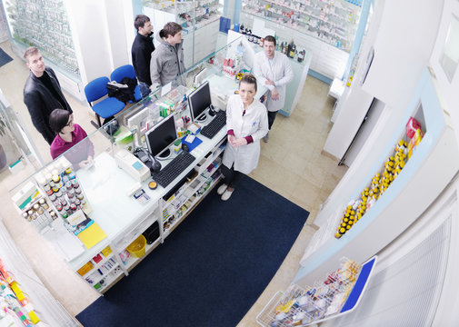 pharmacist suggesting medical drug to buyer in pharmacy
