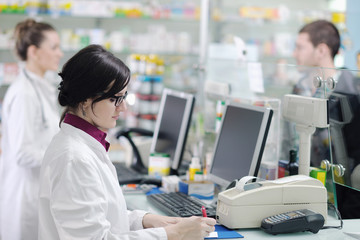 pharmacist suggesting medical drug in pharmacy drugstore