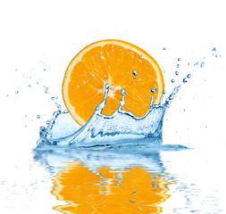 Slice of orange falling into water, isolated on white background