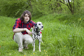 boy and the dalmatian dog - obrazy, fototapety, plakaty