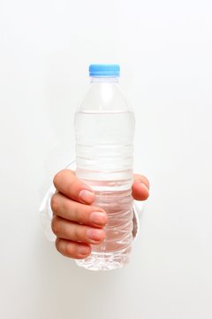 Plastic water bottle in the hand