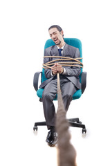 Businessman tied with rope