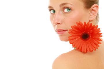 A beautiful young woman with a flower, isolated on white
