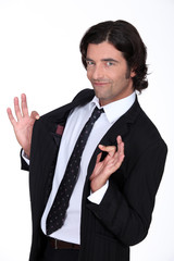 Businessman holding jacket open