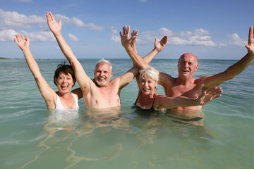 Retired people swimming in the ocean