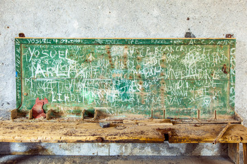 chalk board in abandoned factory