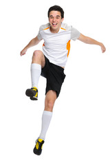 soccer player jumps up and shouts with joy