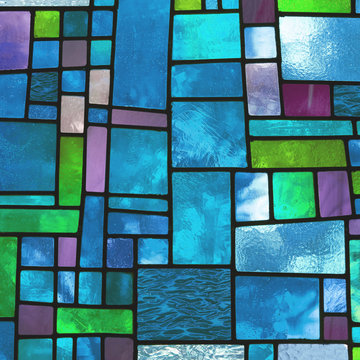 Multicolored stained blue glass window, square format