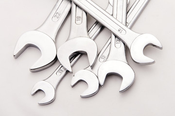 Steel spanners on each other.