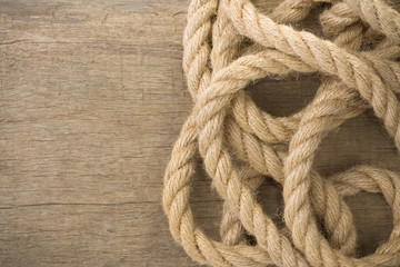 ship ropes on wood background