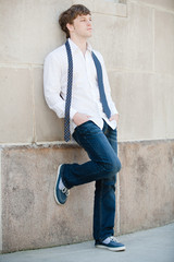 Obraz premium Handsome man in while shirt relaxing.