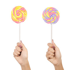 two hands holding a lollipop over white background