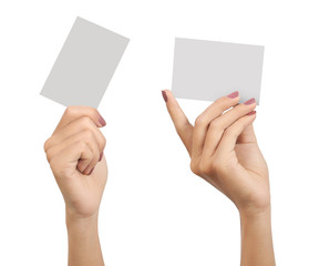 two hands of a woman carrying a blank card