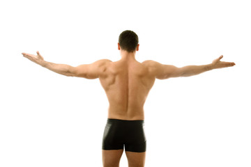 Fototapeta na wymiar Young bodybuilder showing his biceps