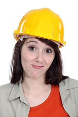 Bemused female builder