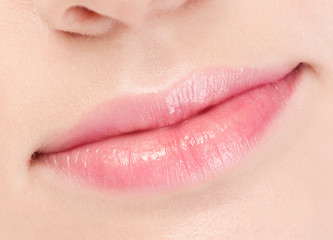 Fototapeta premium Close-up face of beauty young woman. Lips zone