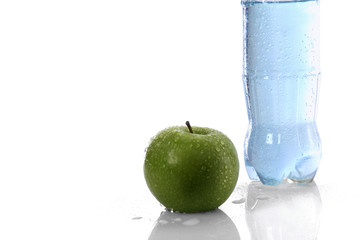 a shot of towel, apple and a bottle with water - isolated
