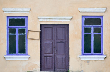 Fototapeta na wymiar wall with door and two windows