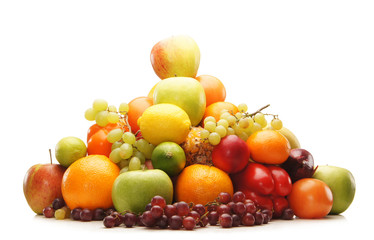 A huge pile of fresh and tasty fruits on a white background