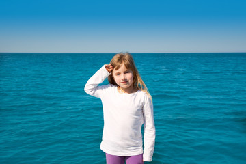 blond little kid girl sailing in a boat