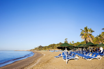 Sun Loungers on a Sandy Beach in Marbella