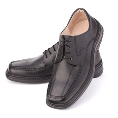 Black glossy man’s shoes with shoelaces