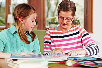 two teenage girls doing homework