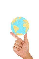 Hand hold the world created from paper