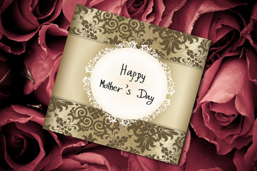 Mother's Day card on a background of red roses