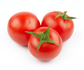 fresh three tomatoes on a white background