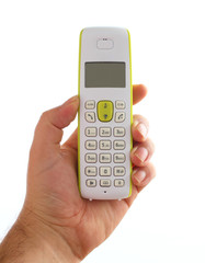 hand holding wireless phone isolated on white background