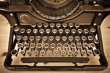 Antique typewriter on sepia - 41467663