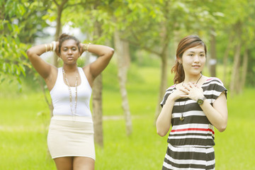 Fototapeta premium Two different races woman, black and asian.