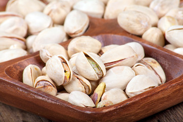 Pistachios in a wooden bowl