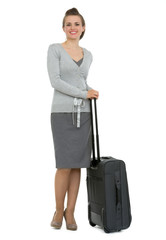 Full length portrait of traveling woman with suitcase