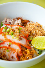 Egg chinese dry noodles with roast red pork, lemon and soup