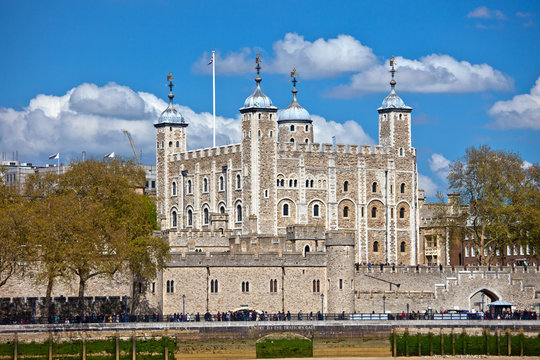 The Tower of London with blue sky and small clouds